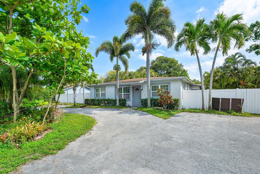 Welcome to this spacious 6-bedroom, 3-bath residence nestled on an oversized lot spanning over half an acre, one of the largest parcels in Margate. The property is graced with two mature mango trees, lending charm and lush greenery to the expansive backyard. Inside, enjoy an updated kitchen boasting stainless steel appliances and sleek finishes, blending modern convenience with bright, open living space A beautifully designed circular driveway adds curb appeal and offers effortless access and parking. With six bedrooms, three fully renovated bathrooms, and an ideal location near Margate amenities and major roadways, this home is exceptional for large families or those who love entertaining and outdoor living.