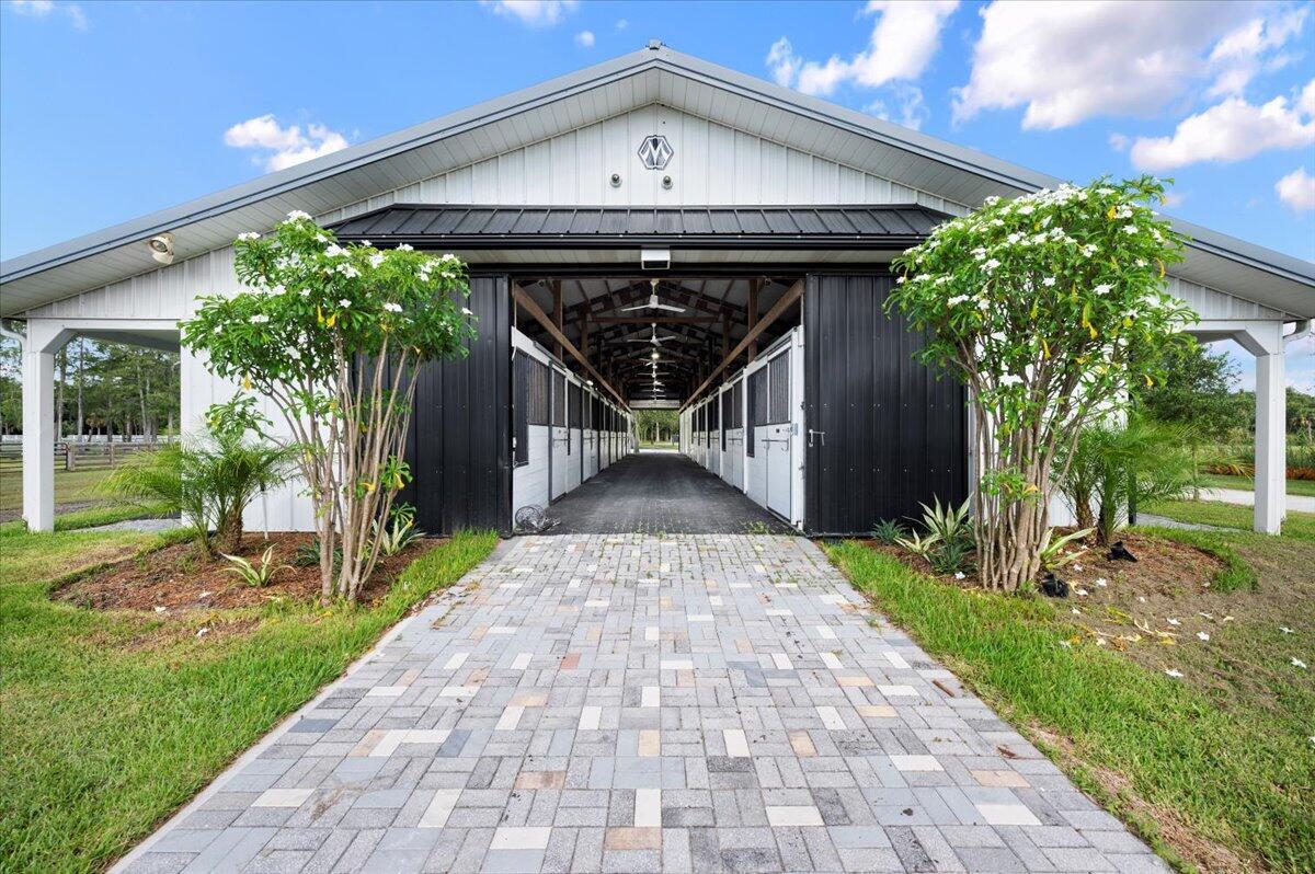 Amazing opportunity to lease this gorgeous barn offering 12 rubber matted stalls that are 12x12 with automatic waterers and fans. Perfectly located in Jupiter Farms this 36x100 barn has a full bath, feed, tack & laundry room and a lounge area with a refrigerator & microwave. Tenant shall be responsible for maintaining dressage arena.