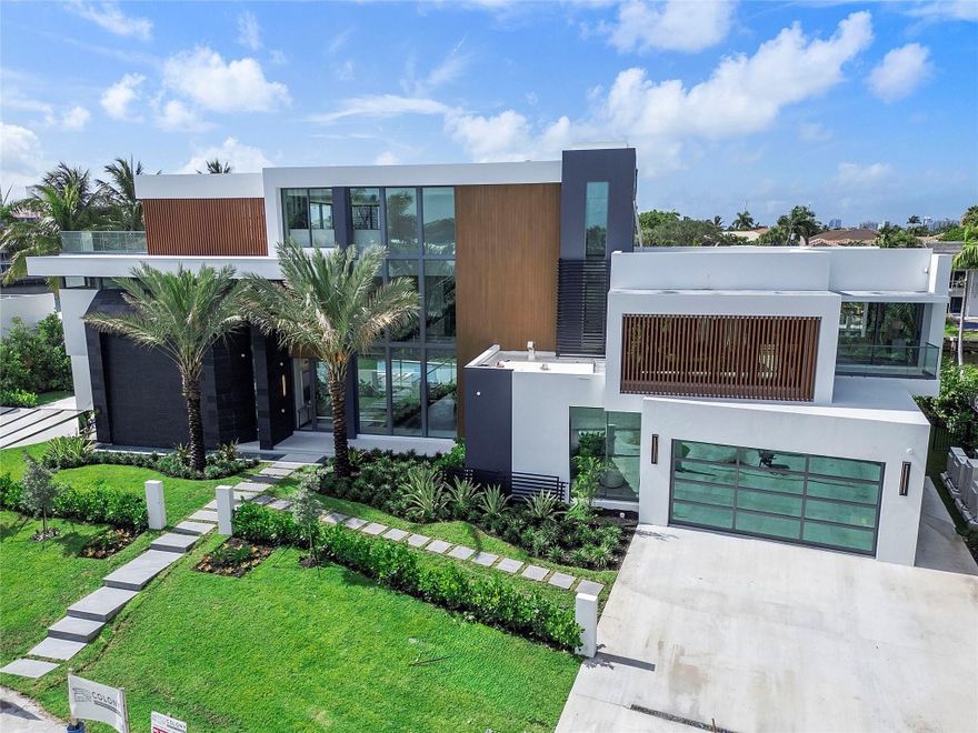 This Incredible 3-Story Modern Resort Sanctuary is Perfectly Designed by Cicardo Development to Inspire the Highest Level of Luxury Waterfront Living Delivered in Ft Lauderdale's Coral Ridge Community. Exceptionally Positioned on a Prime Oversized Lot, Southeast Exposure, 1 off the point, on 153 feet of waterfront in a no wake zone. The Ultimate Indoor/Outdoor Living Experience, Finished with the Highest Level of Italian craftsmanship over 12,976 sq ft of total living area, 6 Bedrooms, 8 Baths, Club Room, Home Gym, Office, Spa w/Sauna/Cold Plunge, 3rd Floor Entertainment w/ Roof Top Sky Lounge, Chef Kitchen, Butler Kitchen, Crew Quarters lower level, Flow Through 4 Car Garage with Lift Capabilities for 8 cars. Expansive Backyard Resort with Enormous Pool, Swim up Dock Bar, Summer Kitchen!