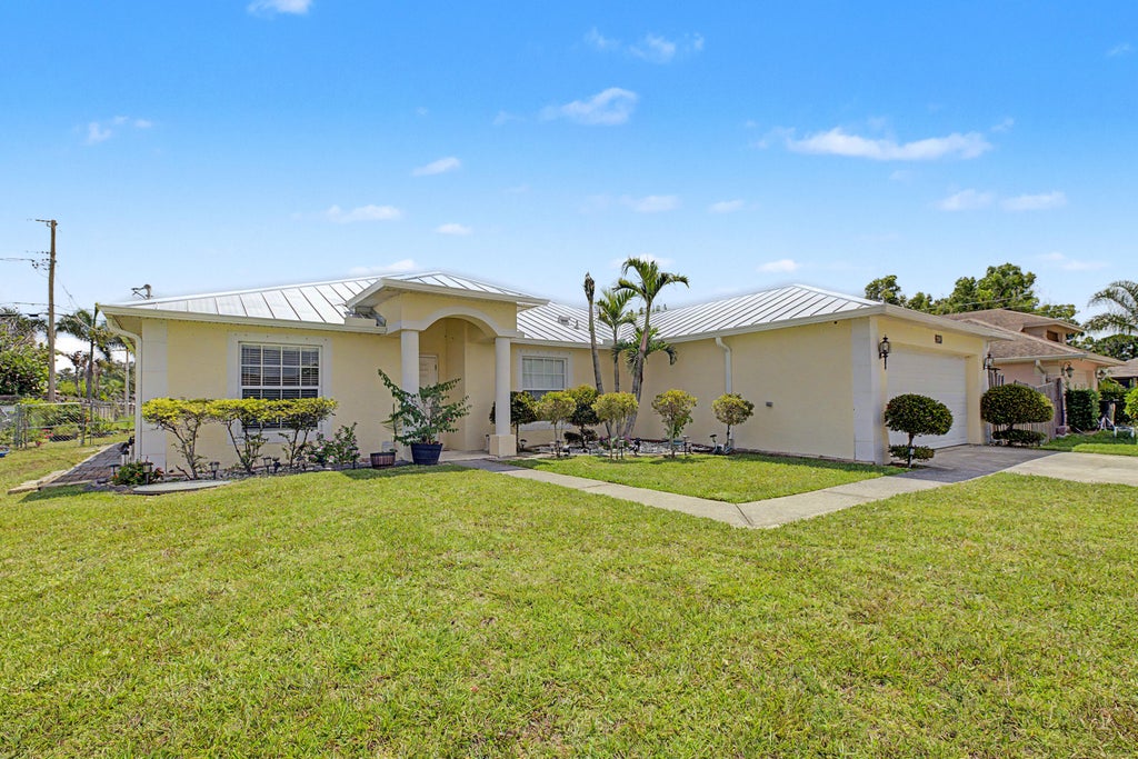 Photo of 2585 SE LAKEWOOD Street, Port Saint Lucie, FL 34952 (MLS # B26067738)