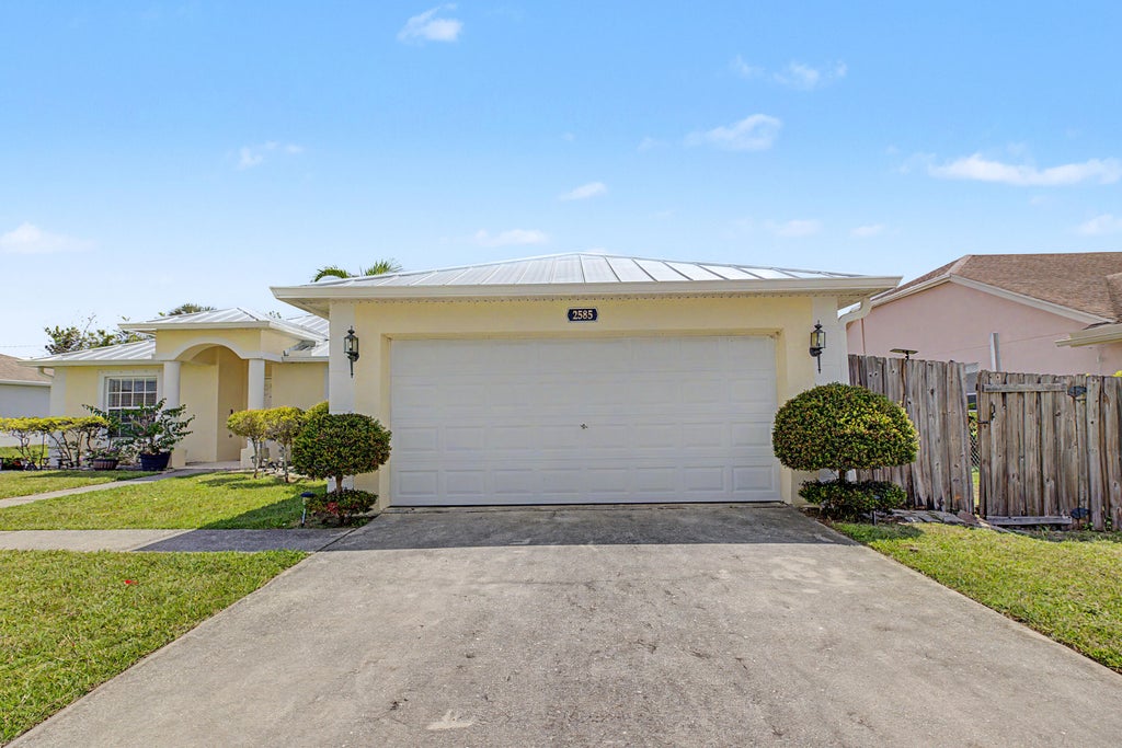 Photo of 2585 SE LAKEWOOD Street, Port Saint Lucie, FL 34952 (MLS # B26067738)