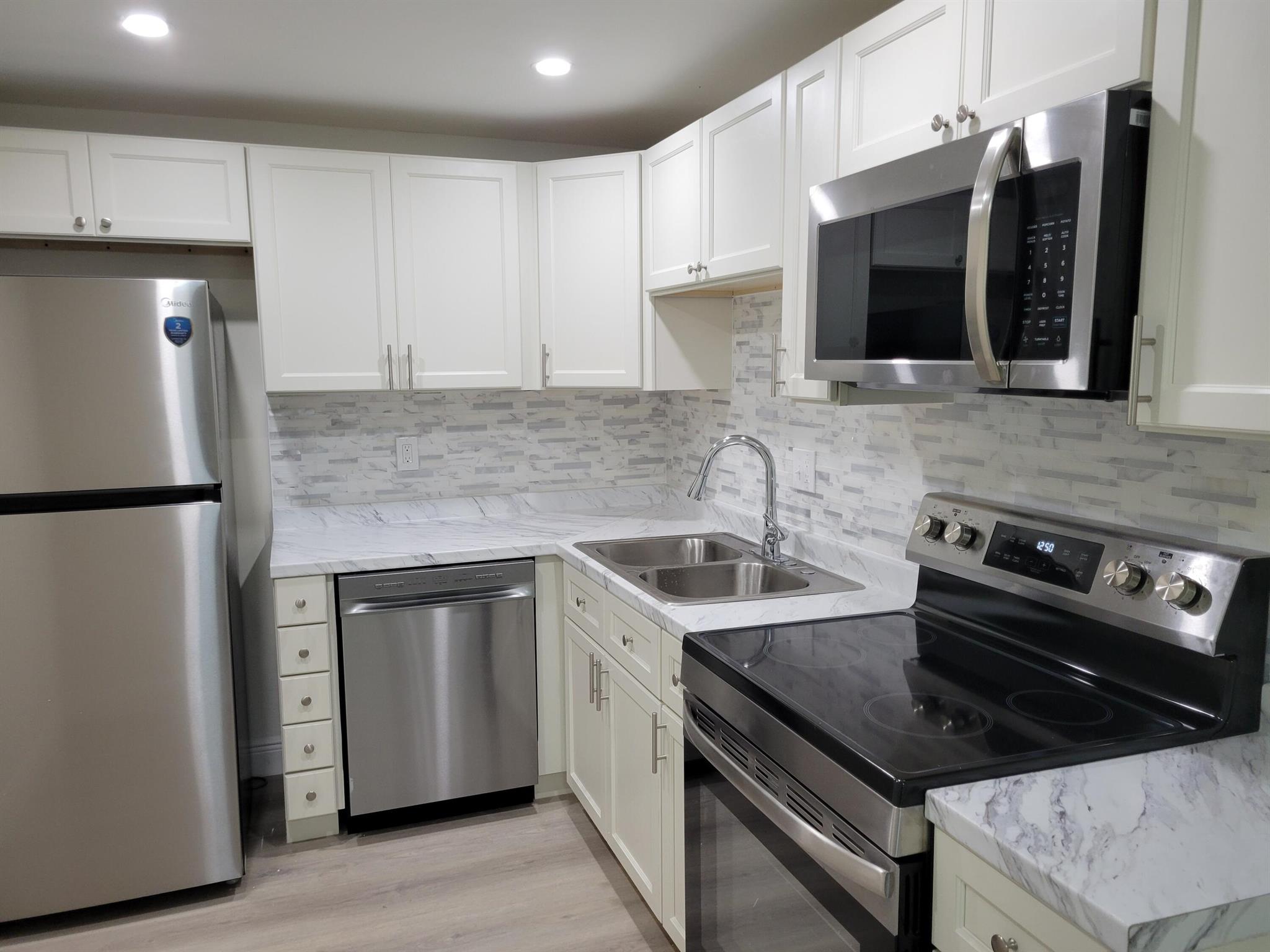 Renovated. Split floor plan 2 bedrooms 2-bathrooms unit. New kitchen, new stainless steel appliances, new bathrooms, new flooring and more. First floor, secure entrance building,. Community amenities include pool, tennis court, and BBQ area. Walk to FAU, located near I-95, Town Center Mall, Mizner park, US-1 beaches. Rent includes water, trash, and basic cable