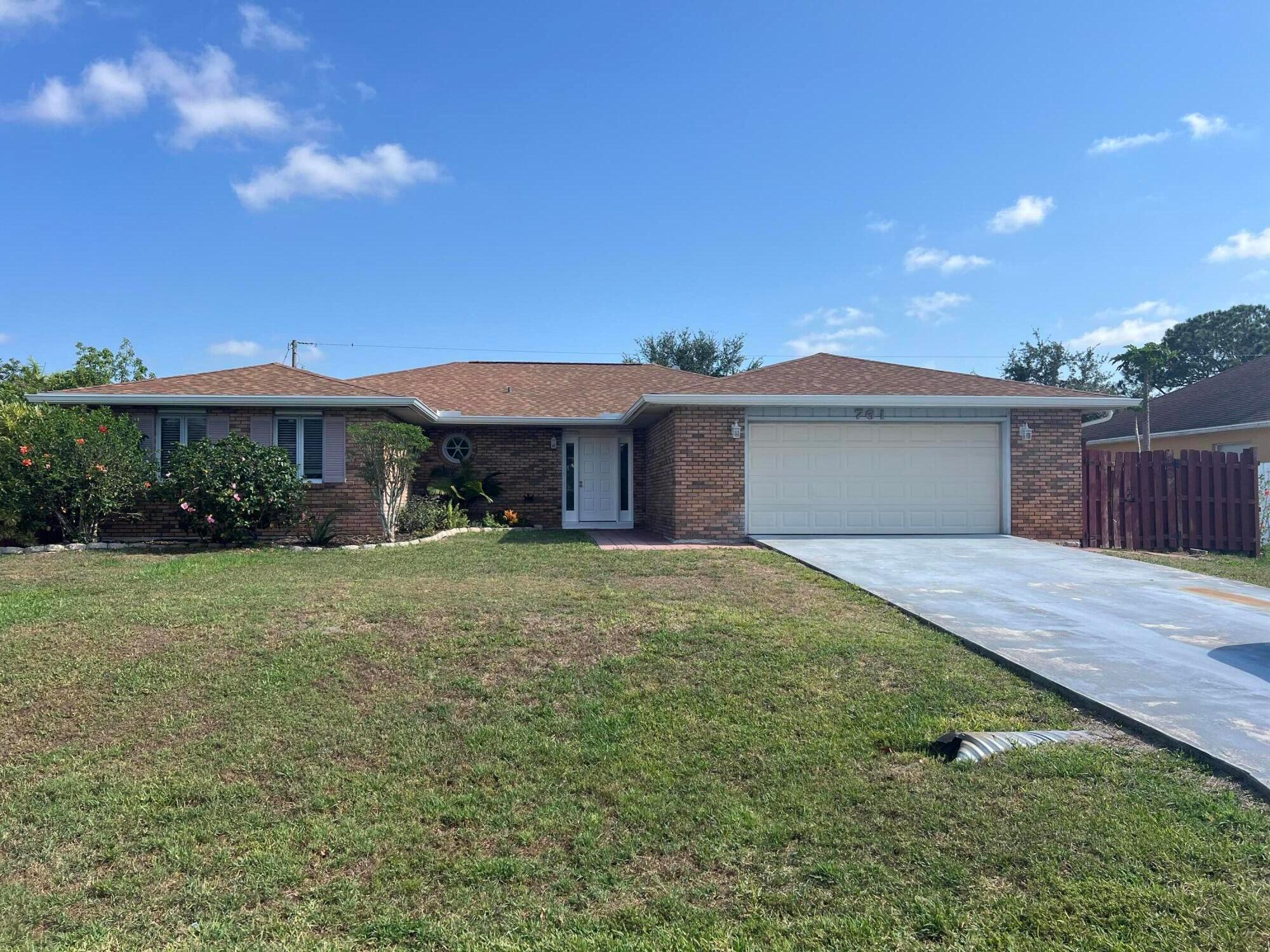 3/2/2, fenced yard in St Lucie West area. Close to everything. Ideal for families. New flooring, new roof, fresh paint throughout. Fenced yard with large patio for entertaining. Lawn maintenance included.