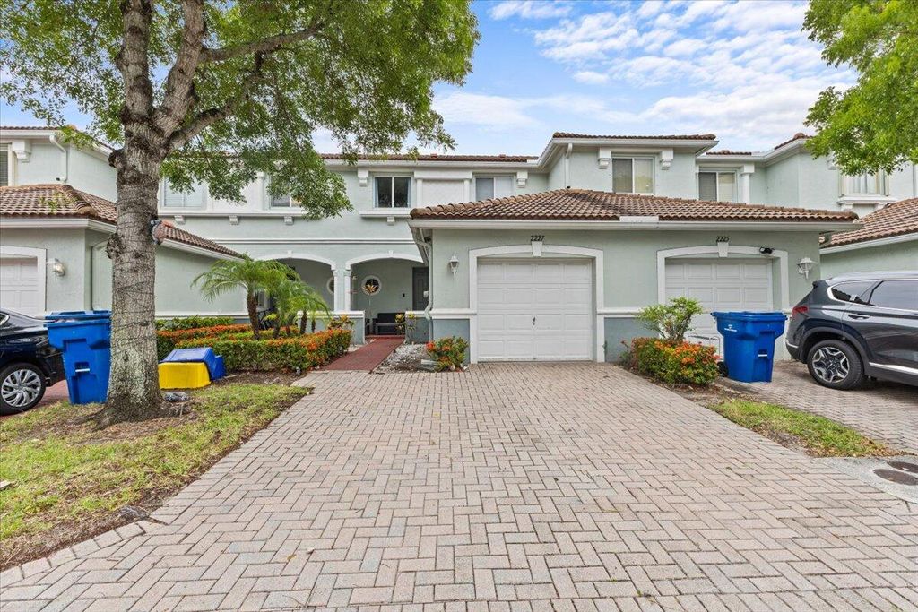 Photo of 2227 Oakmont Drive, Riviera Beach, FL 33404 (MLS # R11159323)
