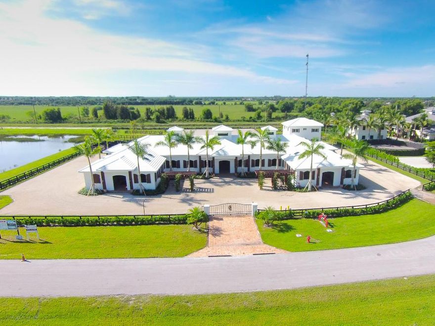 Sunset West Farm is a spectacular 4 acre equestrian facility that features a twenty-six stall stable, three bedroom staff apartment, six paddocks, an all weather ring and a five-horse walker. A gated driveway entrance welcomes you to the property with ample parking space. The twenty-six stall stable, finished with the finest building materials, includes two tack rooms, two feed rooms, two laundry rooms, four grooming/wash stalls, a lounge with private full bath, office and powder bath. The stalls are 12' x 12' and include 3/4''' rubber mats, sliding stall doors, arched exterior windows, and Oasis paddle fans. The ceilings over the stalls and stable aisles are finished with tongue and groove v-joint pine and showcase a large chandelier at the center of the stable and two smaller chandeliers in the aisles. Hurricane proof roll-up doors at seven stable exits and colonial shutters at all stall window openings ensure added safety and security. The stable is fly spray system complete and includes nozzles in ceilings, all stalls and stable aisles with the tank located in the feed room.

A separate two story building on the property includes a garage on the first floor. The second floor grooms apartment offers three bedrooms, two and a half baths, full kitchen, and ceramic tile throughout.

The 135' x 220' all weather jump ring is finished with Martin-Collins footing. Six paddocks with three-rail wood fencing are located throughout the property. The full lot automatic sprinkler system provides complete coverage of the property and includes six water cannons covering the jump ring.