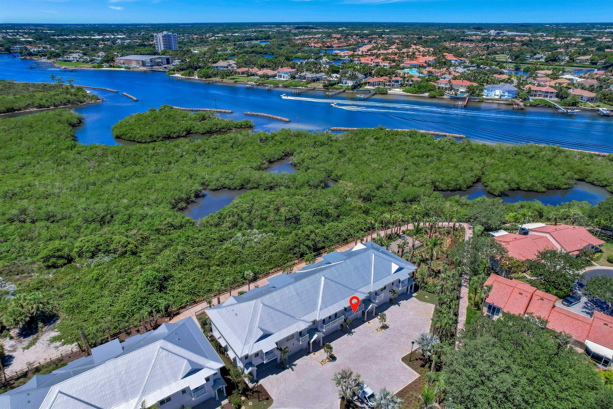 Experience coastal luxury in this newly completed, never-lived-in 3 bedroom, 2.5 bath townhouse ideally located in the heart of Jupiter, within walking distance to the ocean and Intracoastal. This residence offers a bright, open floor plan with soaring ceilings, impact windows, and designer finishes throughout. The gourmet kitchen features custom cabinetry, quartz countertops, and high-end stainless steel appliances. Upstairs, the spacious primary suite includes a spa-inspired bath and private balcony with sweeping views of the Intracoastal and preserve. Community amenities include a resort-style pool, fitness center, children's playground, and walking path to many shops and restaurants. Just minutes to world-class boating, golf, fine dining, and shopping.