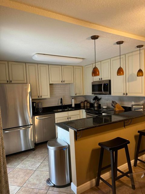 Photo of 2210 22nd Lane, Palm Beach Gardens, FL 33418 (MLS # B26005982)