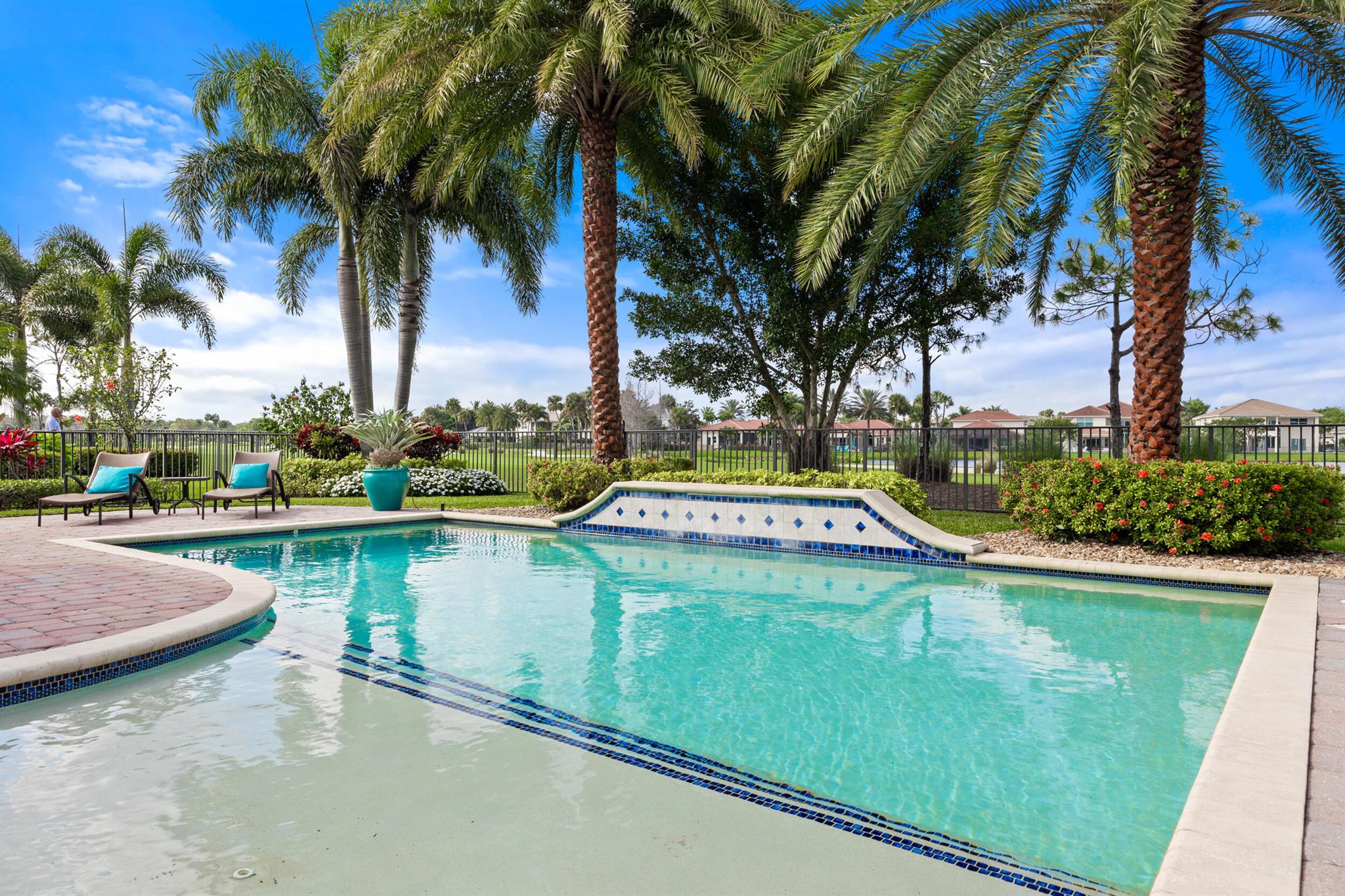 Exquisite Estate Home with Golf Membership in Jupiter Country Club. Discover the epitome of luxury living in this single-level 'CASTANIA' model home, nestled in the Heritage Estates section of the Community. Offering captivating golf course and serene water views, this meticulously maintained residence is welcoming and peaceful. Embark on your Dream Lifestyle and Experience the perfect fusion of relaxing interior living and serene outdoor tranquility. Whether unwinding by the pool, hosting memorable gatherings, or savoring the natural beauty surrounding your home, this exceptional property promises a life of contentment. The spacious floor plan, features 4 bedrooms, with ensuite bath and walk-in closet, this home provides generous living space. The secluded Owner's Suite boasts dual cl