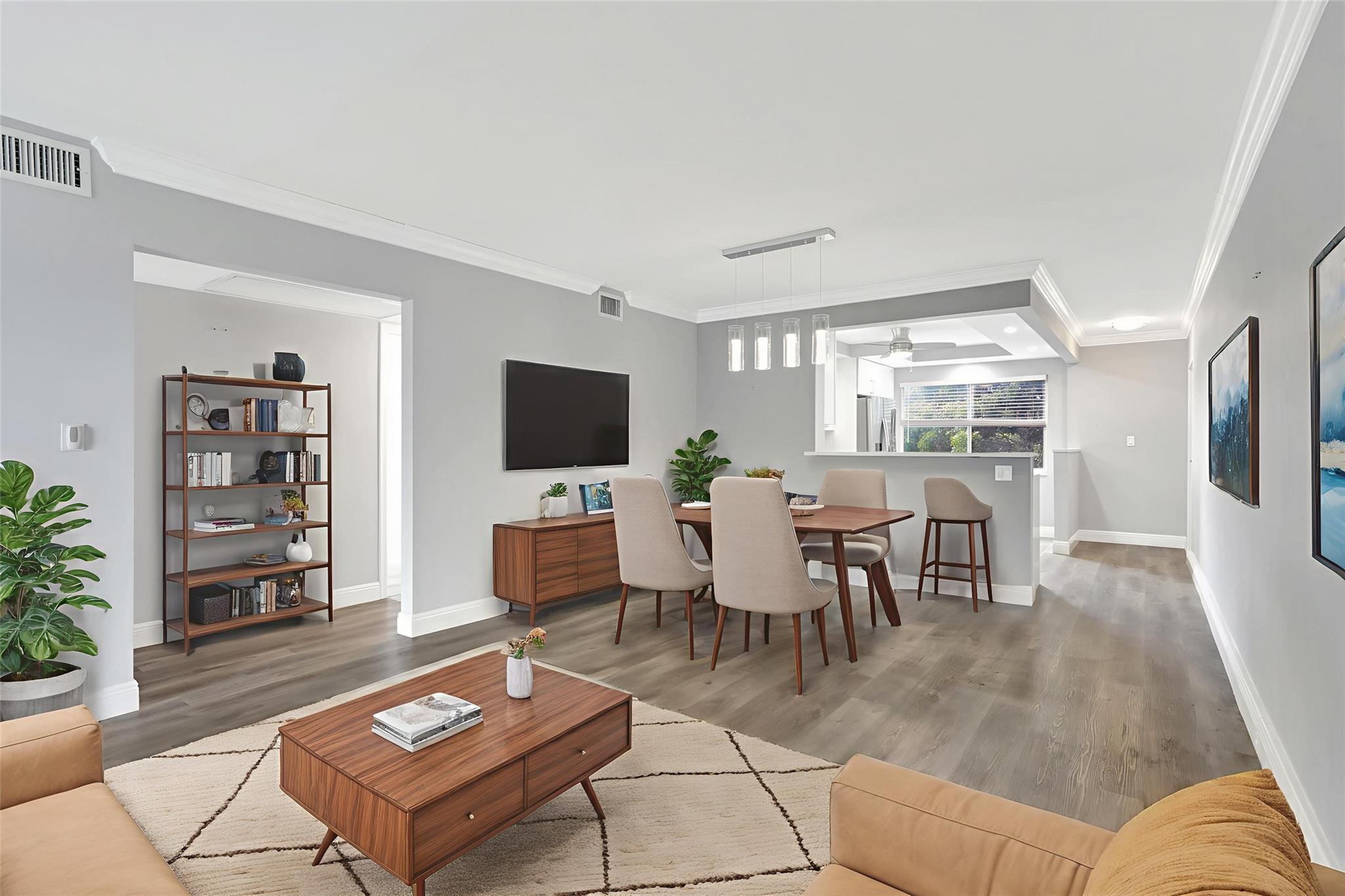 DON’T MISS this beautifully remodeled 2/2 Corner Unit in Wynmoor, located on the Golf Course with a stunning water view. The chef’s kitchen features wood cabinets, elegant quartzite countertops, stainless steel appliances, and new ceiling with hi-hat lighting. Open floorplan with plenty of natural light. Impact windows in kitchen, 2nd bedroom, and front door. Bathrooms have quartz, new vanities, and frameless shower doors. Gorgeous blonde vinyl floors, crown molding, and new baseboards throughout. Fully funded building with new elevator, roof, and fully paid assessments. Smoke-free living. AC 2020. Pool right outside unit. 55+ community with amenities like pool, theater, restaurant, bridge, poker, pottery, glass making and a new cafe coming next to the pool!