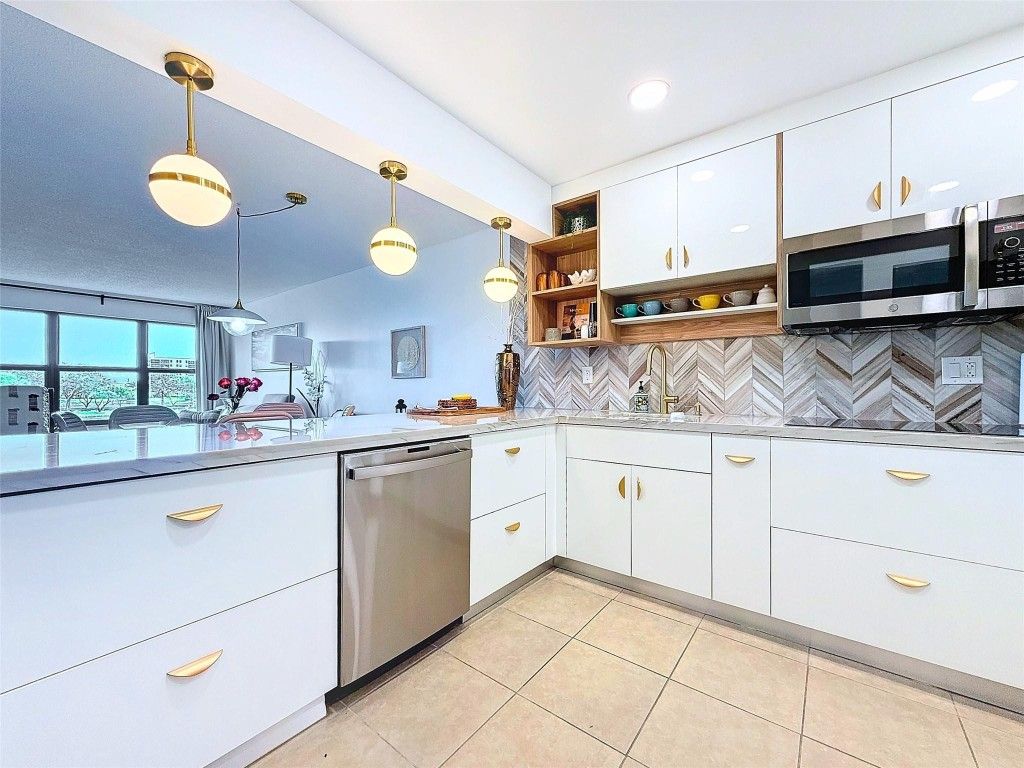 Photo of 2311 S Cypress Bend Drive #319, Pompano Beach, FL 33069 (MLS # F10487647)