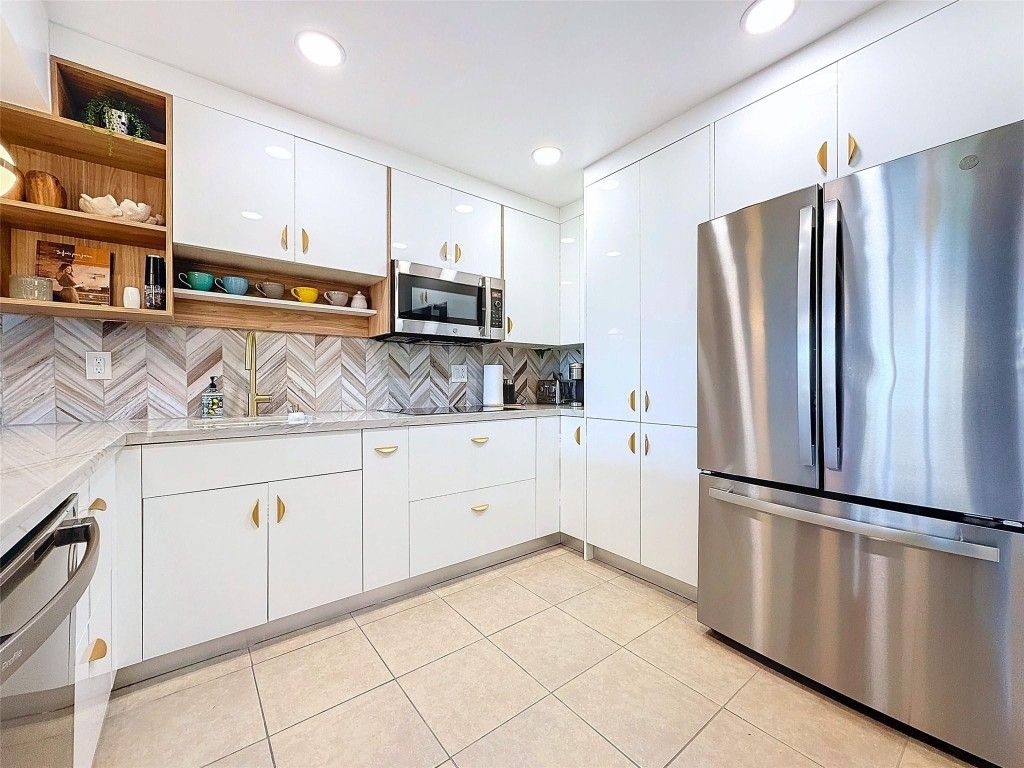 Photo of 2311 S Cypress Bend Drive #319, Pompano Beach, FL 33069 (MLS # F10487647)