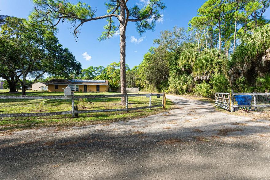 Renovated 4-bedroom, 2-bath CBS pool home on a spacious, fully fenced lot in West Palm Beach. This move-in-ready home features all-tile flooring throughout, all new appliances, and a screened pool enclosure ideal for year-round enjoyment. The versatile oversized lot offers ample space for cars, boats, trucks, trailers, or work vehicles—perfect for those needing room to spread out. Inside you'll find generous living areas, including formal living and dining rooms, a family room, and an indoor laundry room with abundant cabinetry. French doors open to the screened patio, creating great indoor-outdoor flow. Quiet dead-end street location with convenient access to the Florida Turnpike, shopping, and major roadways.