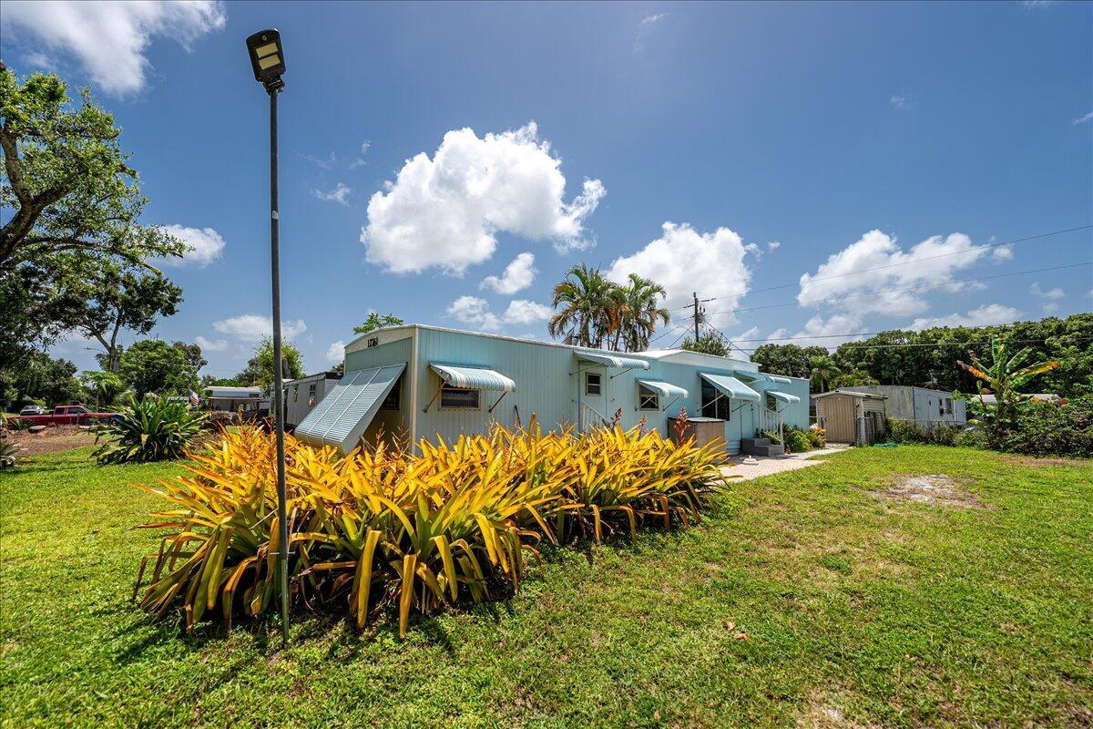 Affordable mobile home in great Stuart location! Come see this two bedroom, one bath mobile home with open floor plan, updated wood laminate floors, fresh paint, and gourmet kitchen w/ appliances. Beautifully landscaped lot, screened porch and storage shed. YOU OWN THE LAND! NO FEES, NO RESTRICTIONS! Great investment property!
