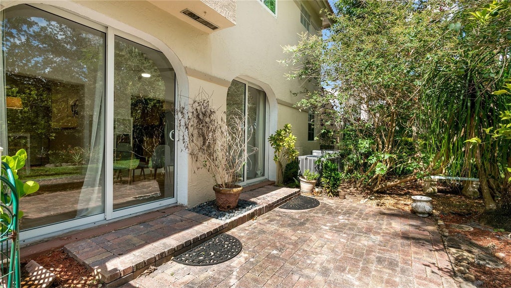 Photo of 6525 VIA REGINA #0100, Boca Raton, FL 33433 (MLS # B26083427)
