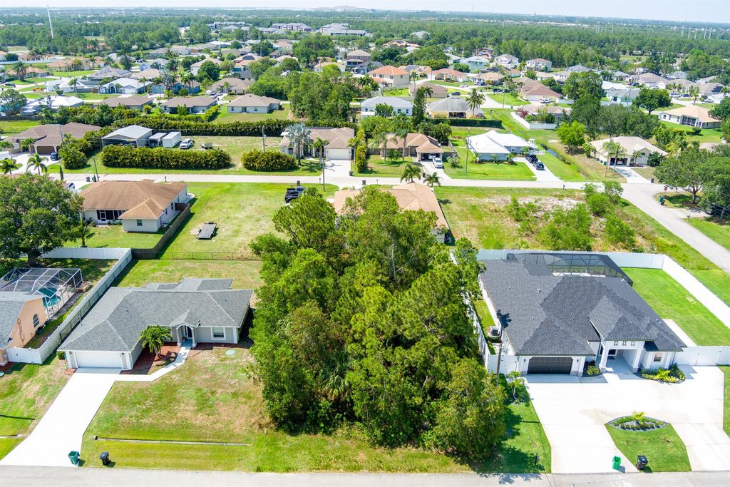 Photo of 5468 NW Arbutus Lane, Port Saint Lucie, FL 34986 (MLS # R10991511)