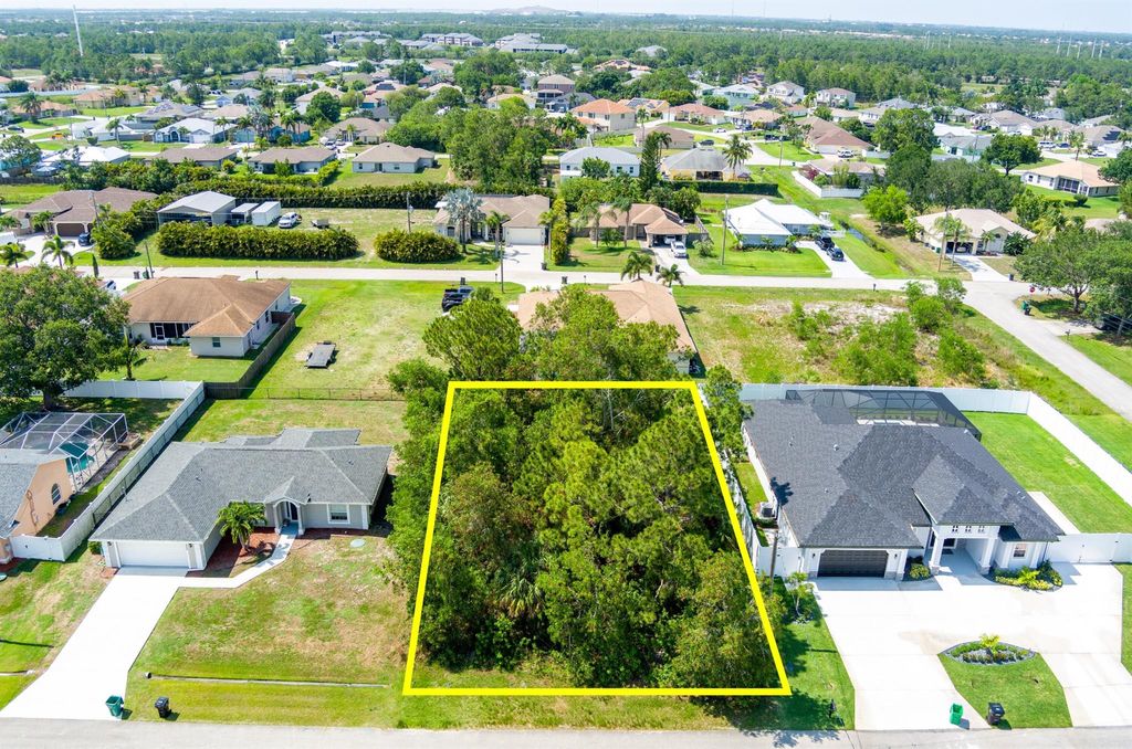 Photo of 5468 NW Arbutus Lane, Port Saint Lucie, FL 34986 (MLS # R10991511)