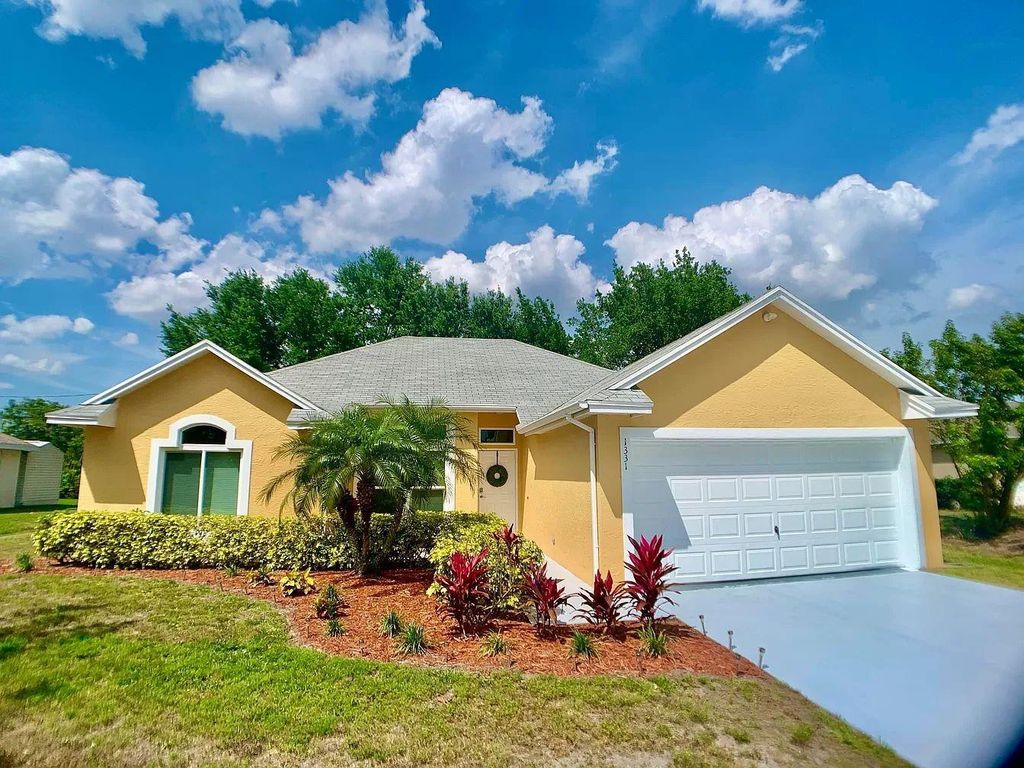 Photo of 1331 SW Calmar Avenue, Port Saint Lucie, FL 34953 (MLS # F10412612)