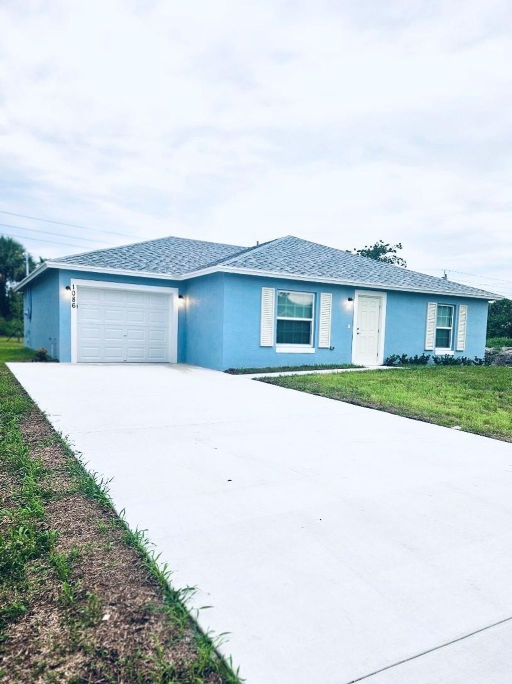 Photo of 1086 SW Eureka Avenue, Port Saint Lucie, FL 34953 (MLS # F10450624)