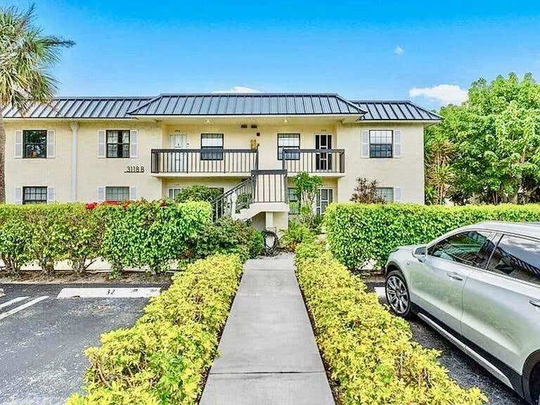 Photo of 3118 FLORIDA BLVD #206-B, Delray Beach, FL 33483 (MLS # B26068537)