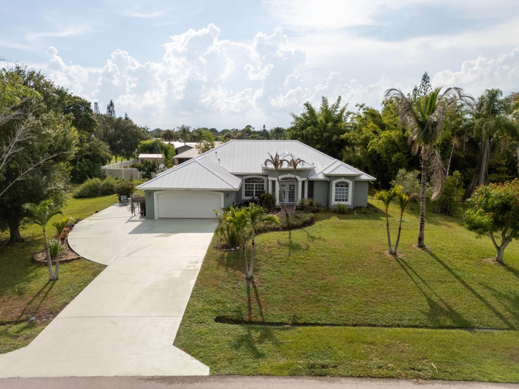 Photo of 2142 SE Morningside Boulevard, Port Saint Lucie, FL 34952 (MLS # B26065870)