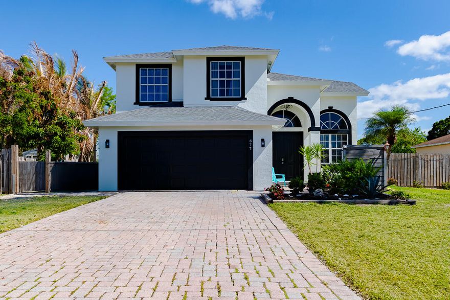 Welcome to this spacious two story pool home offering 4 bedrooms and 2.5 baths with a brand new roof and freshly painted exterior. All bedrooms are upstairs, giving you comfortable and functional living space on the main level with a natural flow for both everyday living and entertaining.  Step outside to a true backyard retreat featuring a private pool with a rock waterfall and slide, a covered screened patio perfect for year round enjoyment, and a fully fenced yard for added privacy. A long paver driveway provides plenty of parking and great curb appeal.  Ideally located near top rated schools, shopping, dining, and major roadways, this home combines space, style, and convenience. Move in ready and priced to sell, schedule your showing today before it is gone.