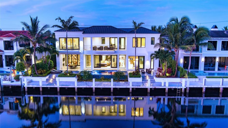 Chic, Modern Deepwater Estate sited on 90+/- feet of waterfrontage on the wide South Grand Canal. Interiors by famed designer, Fanny Haim, this residence sets a new standard for living, with craftsmanship and materials that assure peace of mind. Awe-inspiring views down the waterway from every major room including a gourmet chef's kitchen and luxurious master suite with two separate spa-baths. Amenities include elevator, 22kw gas generator, custom built-ins, Savant Home Automation, electric shades, 3 bay garage, and more. Outdoor entertainment is enjoyed at the heated, resort-style infinity-edge pool with spa and covered lanai with fireplace. Ideal for the avid boater, the 90’ concrete yacht dock is sited on a large turning basin just minutes to the Hillsboro inlet.