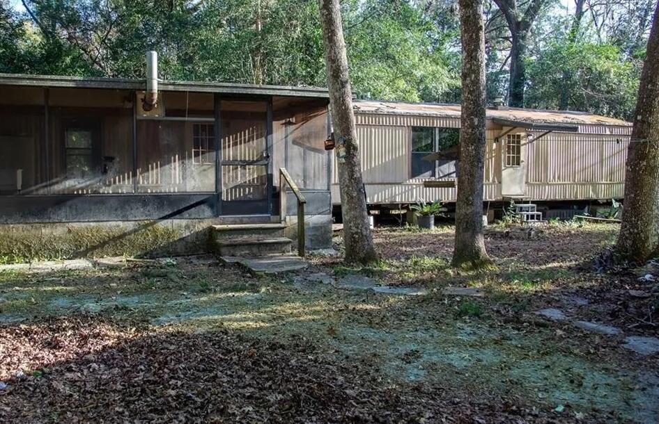 Handyman Special! This 2-bedroom, 2-bath mobile home sits on a spacious quarter-acre lot just off Turner Camp Road, conveniently located near the public boat ramp with access to the beautiful Withlacoochee River. The home features a wood-burning fireplace, an eat-in kitchen, large closets, a screened-in porch, and a utility shed for extra storage. It's close to shopping, restaurants, and the vibrant downtown area of Inverness. Just a short drive to Crystal River, where you can enjoy the natural springs, waterfront dining, and recreational access to the Gulf of Mexico. With some TLC, this property has great potential as a quick flip or long-term investment. Don't miss this affordable opportunity in a fantastic location! More Pictures coming soon.