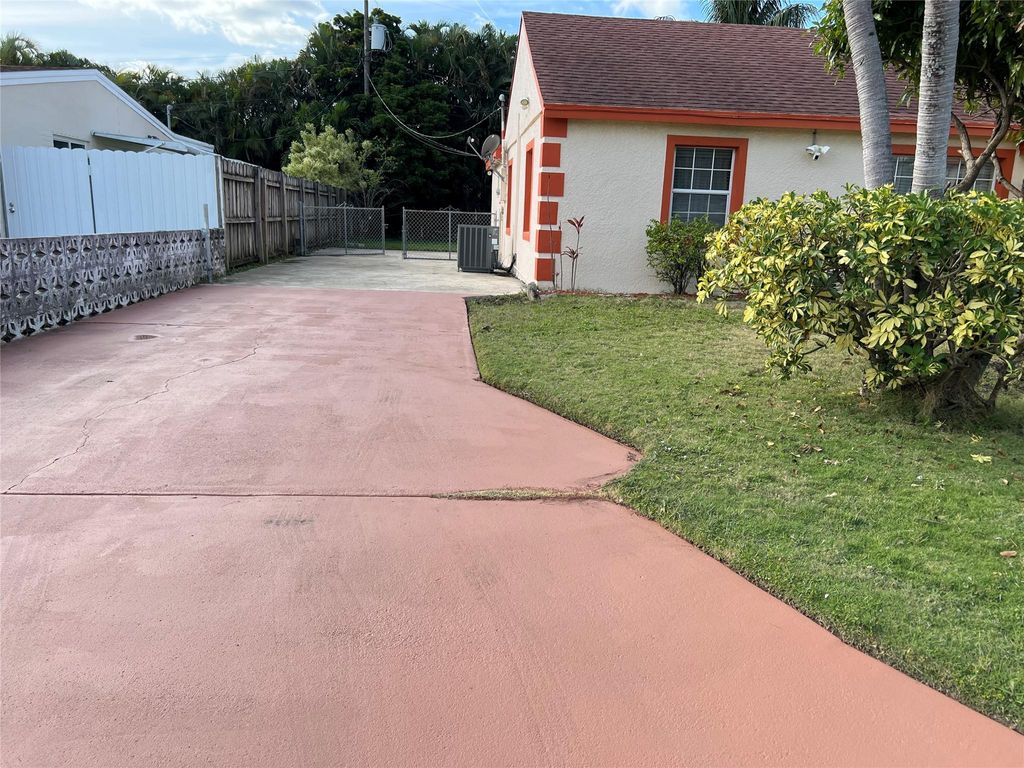 Photo of 909 Helena Drive, Lake Worth, FL 33461 (MLS # F10474228)