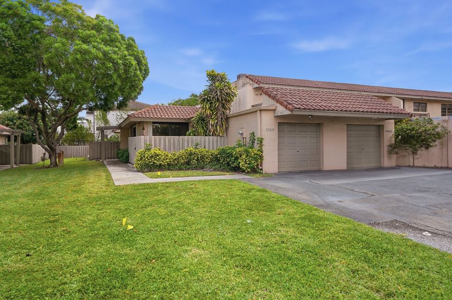 Check out this ideal single story, end unit townhome.  Full sliding doors offer a wall of windows from the living space and open for fresh air.  All IMPACT windows and sliders except one slider. All windows have accordian style shutters as well.  Primary Bedroom walks out to fenced back patio-a perfect spot to enjoy morning coffee.  Large primary bathroom offers dual sink vanity and large soaking tub.  Large walkin closet with built in closet system as well.  Fenced courtyard patio off Kitchen & Dining Area.  Interior laundry area. Garage has been partially converted with AC to an additional room perfect for home office or utility room and can be converted back. This home is just waiting for your personal touches. Rent right away and Pet friendly. Come check it out today!