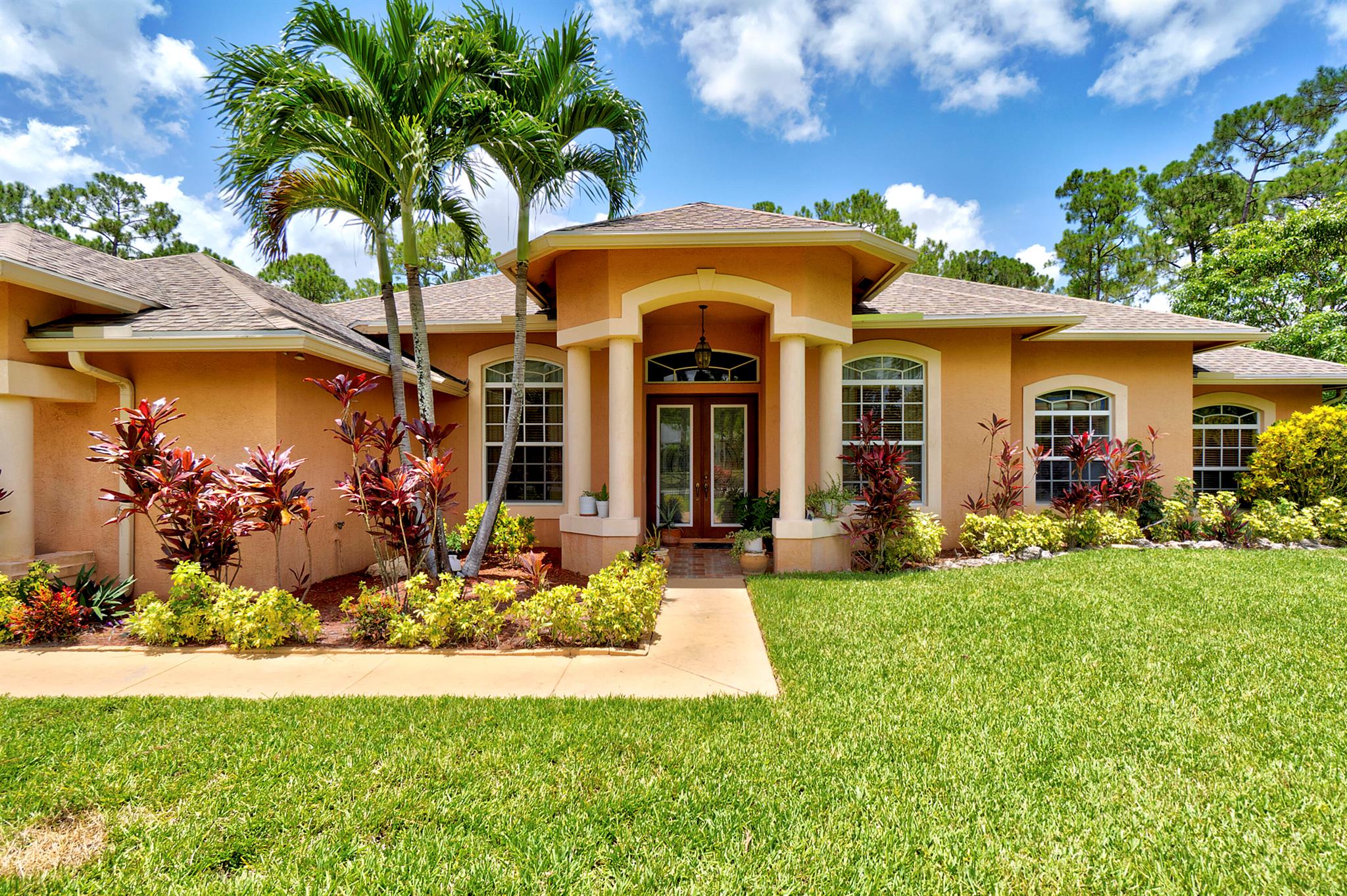 TROPICAL PARADISE ON OVER AN ACRE OF BEAUTIFULLY LANDSCAPED PROPERTY WITH LARGE POOL AND FRESH FRUIT TREES. THIS SPACIOUS 5 BED 3.5 BATH PROPERTY PROVIDES A STRONG FOUNDATION FOR YOUR PERSONAL TOUCH. HUGE PRIMARY BEDROOM WITH CABANA DOOR TO POOL. 5TH BEDROOM CAN BE USED AS OFFICE SPACE. OVERSIZED KITCHEN WITH PLENTY OF CABINETRY, GRANITE COUNTERS AND 2 REFRIGERATORS. 2 ZONE AC. PLENTY OF ROOM TO ENTERTAIN. DO NOT MISS THIS CUSTOM BEAUTY.
