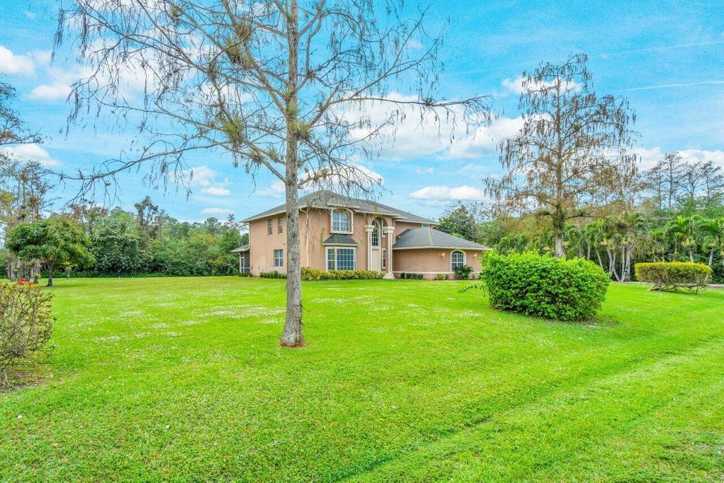 Photo of 16030 Valencia Boulevard, Loxahatchee, FL 33470 (MLS # R10941196)