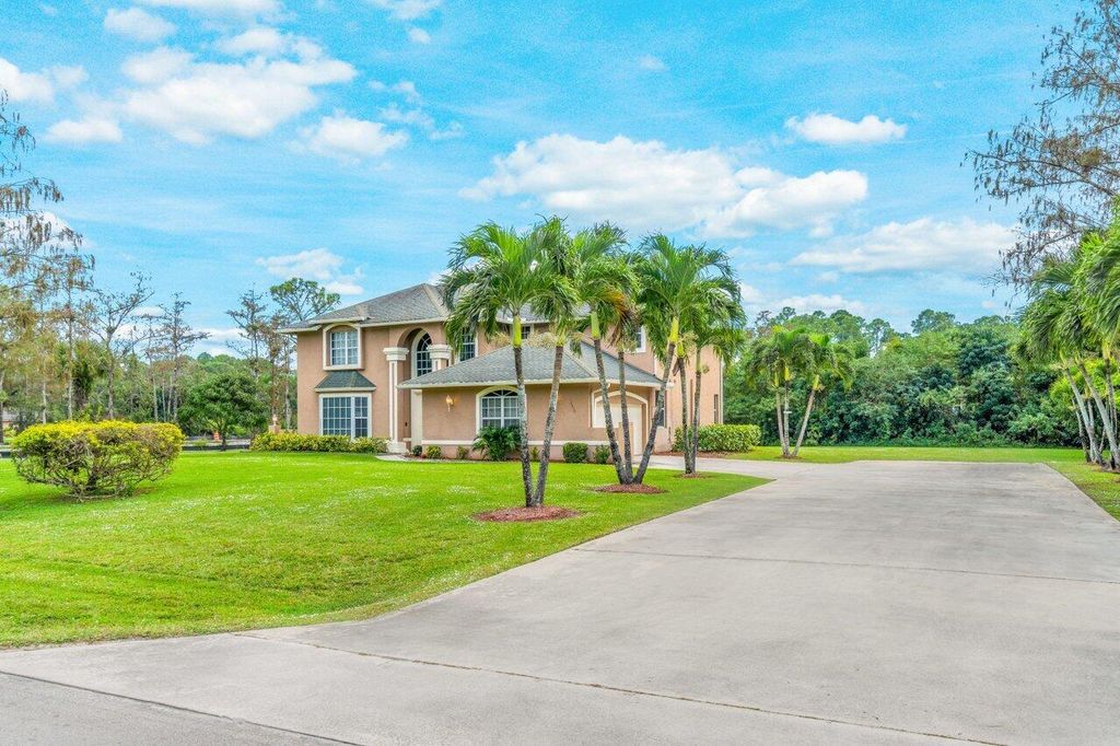 Photo of 16030 Valencia Boulevard, Loxahatchee, FL 33470 (MLS # R10941196)