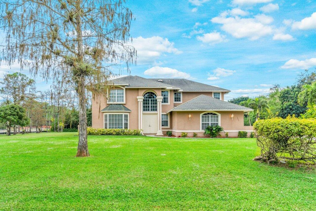 Photo of 16030 Valencia Boulevard, Loxahatchee, FL 33470 (MLS # R10941196)
