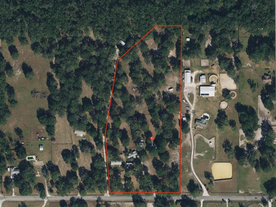 Wonderfully located 11.45 acre farm on a paved road just down the street from the new World Equestrian Center, Publix shopping center, and West Port High School! Live rurally but within 10 minutes to great shopping and restaurants. The property boasts 2 manufactured homes with adorable finishes including 5 bedrooms, 4 bathrooms, cute covered porch, cozy fireplace, newer kitchen appliances and much more! Enjoy the view of the 5 fully fenced pastures with huge granddaddy oaks from your covered porch. The property also boasts 2 barns including 6 stalls, tack room, office, bathroom and there is a covered car port.