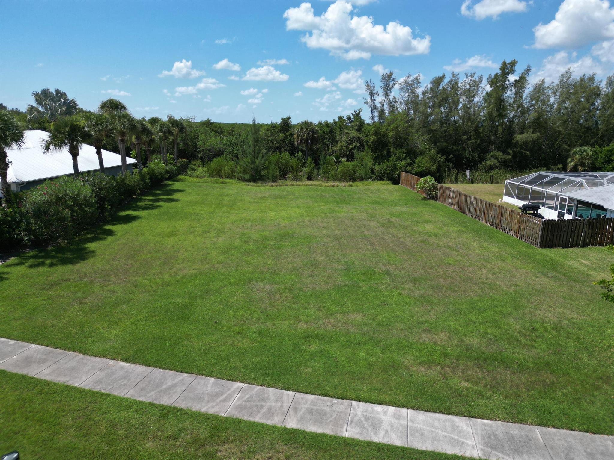 Generously sized homesite available in the sought-after Jennings Cove community! This is a unique chance to secure a spacious half-acre parcel in a stunning coastal setting. Situated on a quiet cul-de-sac and bordering a serene nature preserve, the location offers both privacy and natural beauty. Community guidelines require a minimum of 2,500 square feet of living space and a tile or metal roof--perfect for designing a high-quality custom home. Bring your builder and begin your dream project today on South Hutchinson Island! Enjoy easy access to unspoiled beaches, excellent fishing, boat launches, and more. Embrace the ultimate Florida coastal lifestyle!