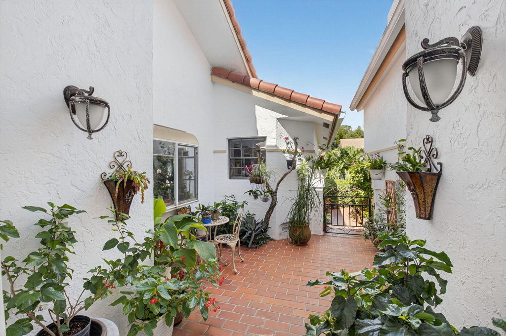 Photo of 10559 Ladypalm Lane #A, Boca Raton, FL 33498 (MLS # R11133017)