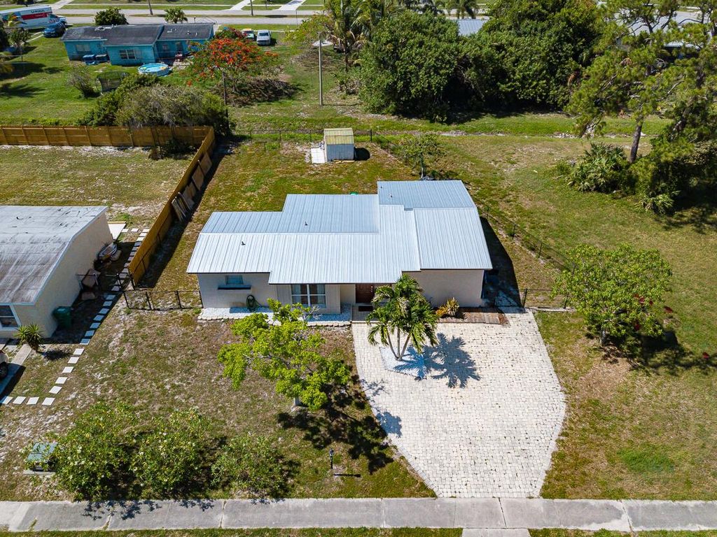 Photo of 170 Princess Drive, Port Saint Lucie, FL 34952 (MLS # R10992743)