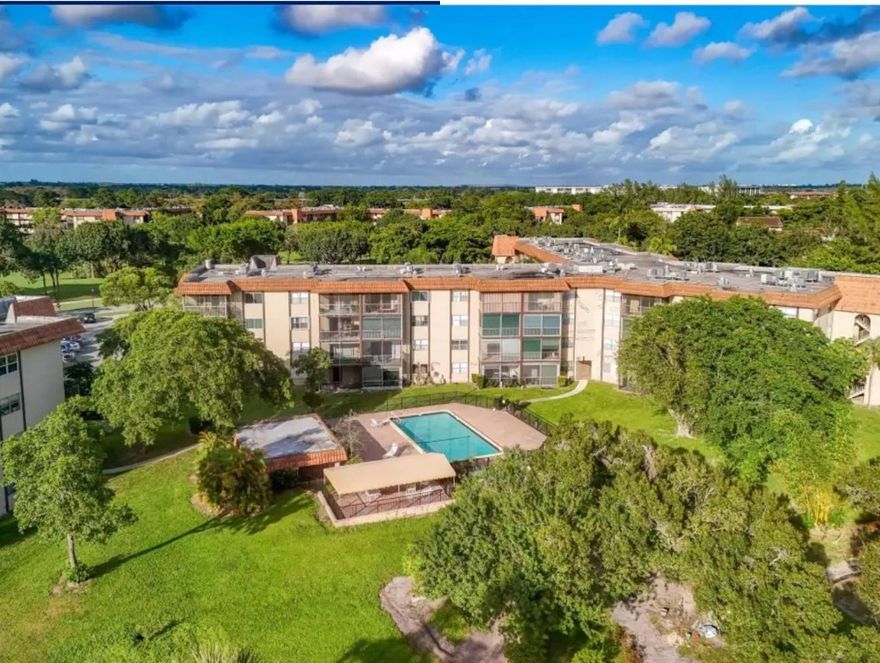 Absolutely beautiful, move-in ready, freshly painted, spacious 2nd floor condo overlooking the pool. White on white Kitchen with stainless steel appliances, large open floorplan with laminate flooring, recessed lighting, and wide baseboards, new interior doors, gorgeous master bathroom with new white vanity, large walk-in closet, big bedrooms, and screened balcony with great views of the pool and grounds. Gated community, well maintained building with laundry and storage on the same floor.