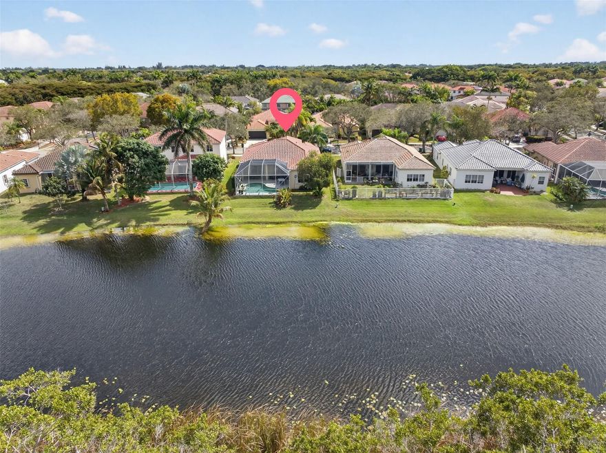 Beautiful one-story lakefront home in the gated community of The Ridges. This 4 bedroom, 2.5 baths residence is in excellent condition and features a NEW roof (2022). Enjoy breathtaking, unobstructed lake views from your private backyard with pool and enclosed patio, perfect for relaxing or entertaining while taking in the serene water views. The home offers laminate flooring throughout, a remodeled kitchen with granite countertops, and a beautifully updated master bathroom. Accordion shutters throughout provide full storm protection and peace of mind. Located in an excellent area near top-rated schools, parks, shopping, and major highways. Community amenities include a clubhouse, pool,  playground, pickleball, basketball and volleyball courts, plus picnic and BBQ areas. A must see!