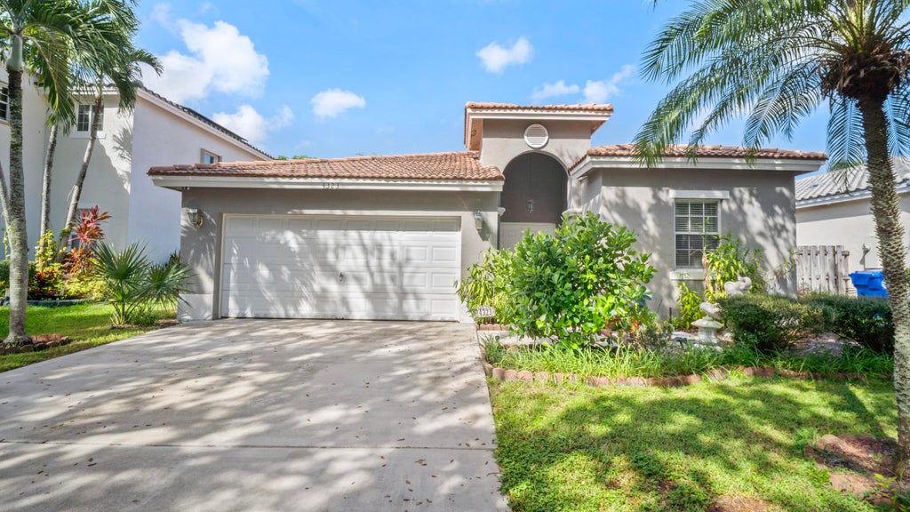 Photo of 4323 NW 44TH Terrace, Coconut Creek, FL 33073 (MLS # B26084272)