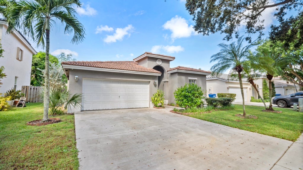 Photo of 4323 NW 44TH Terrace, Coconut Creek, FL 33073 (MLS # B26084272)