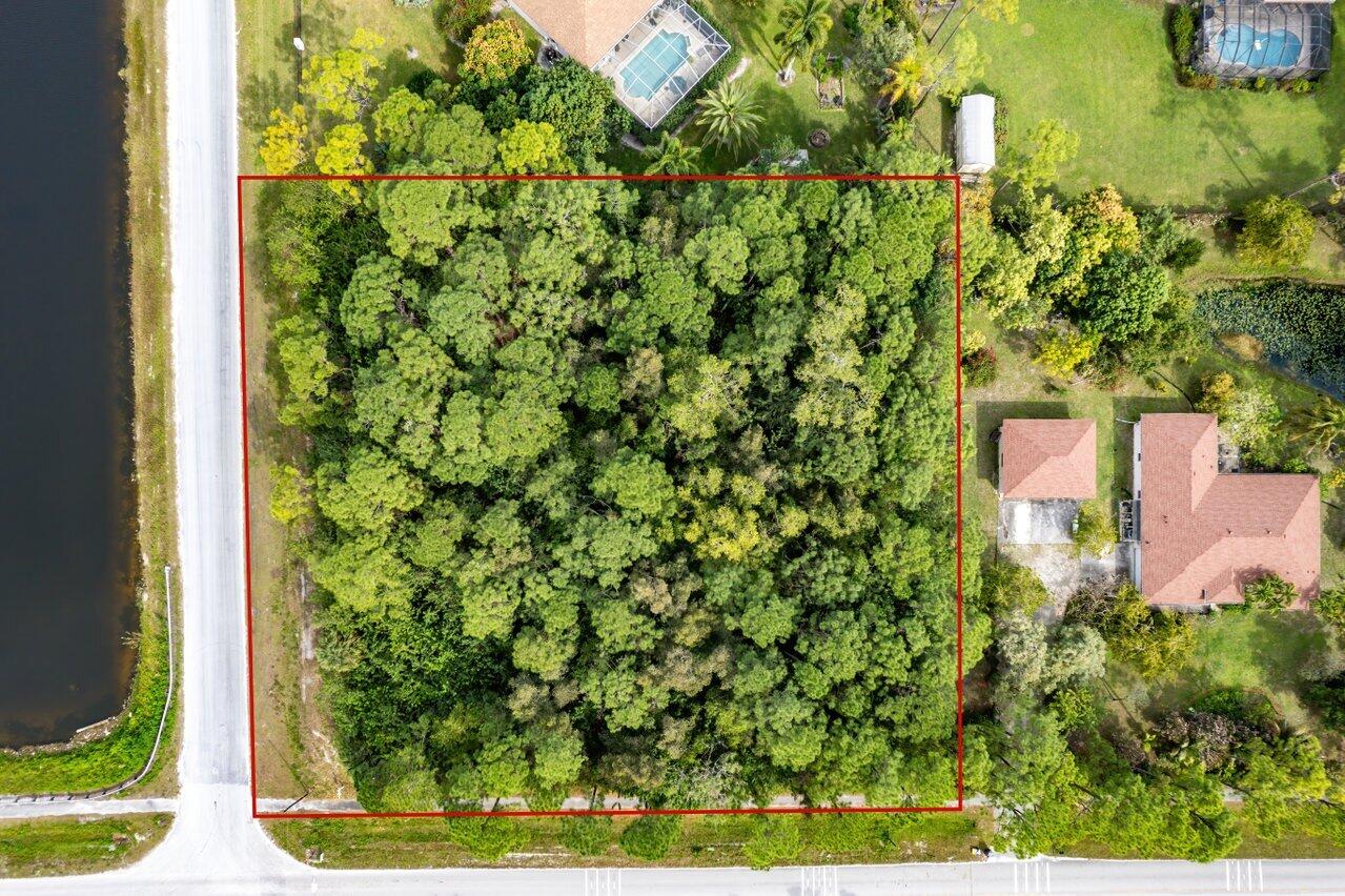 Vacant Land in the highly desirable section of the Acreage to build you dream home! ! 1.67 acres. Paved Road. NO HOA. Adjacent to body of water. This area is booming and this is a superb investment opportunity. DO NOT DISTURB THE NEIGHBORS. DO NOT WALK THE LOT WITHOUT PERMISSION.