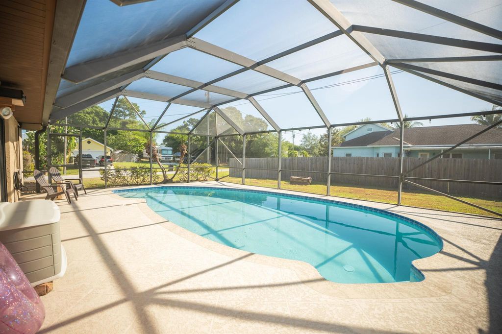 Photo of 1901 SW Ember Street, Port Saint Lucie, FL 34953 (MLS # R10980359)