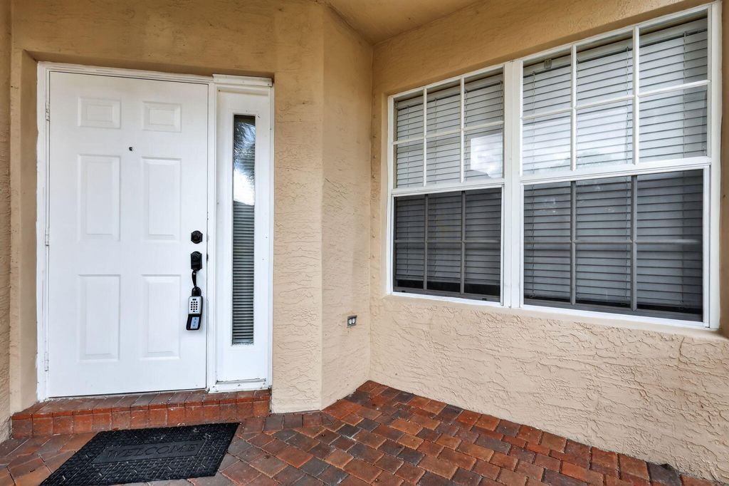 Photo of 5033 Polaris Cove, Greenacres, FL 33463 (MLS # B26001125)