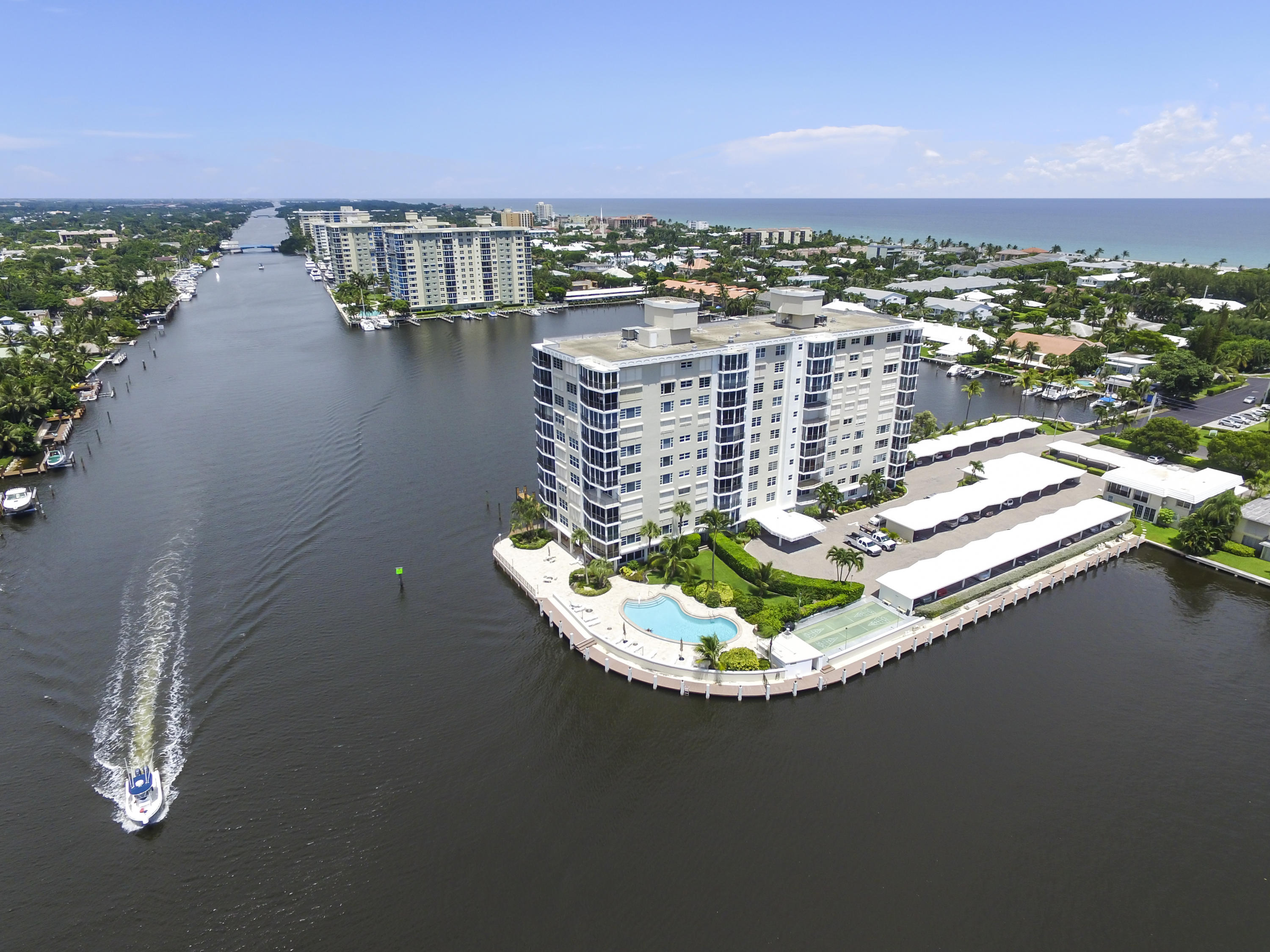 Unique double condo unit on the 6th floor at Seagate Manor offers incredible intracoastal, ocean & city views. 3520SF of air conditioned living space & 4112 total SF with 2 master suites & 3 full baths. Thoughtfully planned design features a large great room with full built-in bar with mini & wine refrigerators; temperature controlled wine room; sitting area overlooking the Intracoastal; spacious dining room and split bedrooms. The master suite has his and hers baths and cedar-lined closets, a sauna and an office. Other features include hurricane impact windows and doors throughout, beautiful wood flooring, full-size laundry room and plenty of storage space. Seagate Manor is a 55+ community with dockage included in the maintenance on a first come-first served basis. (Virtually staged)