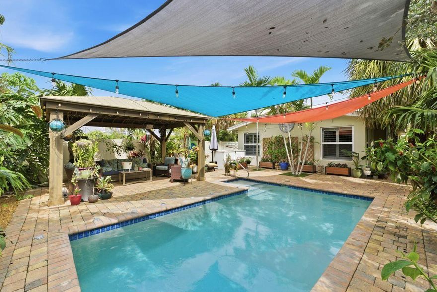 Charming and beautifully remodeled 3 bedrooms, 2 bath pool home blending delightfulness with modern comfort. Thoughtfully updated with new roof 2022, A/C, solar panels 2022, electrical panel 2022, and full impact windows and sliding doors. The gourmet kitchen features quartz countertops, brand-new stainless-steel appliances, and a spacious island for entertaining. Elegant bathrooms, an open floor plan, and seamless indoor-outdoor living flow to a private backyard oasis with sparkling pool and patio. The gazebo invites to relaxation and pleasant day and night times. Electric car charger "universal".  The house is Perfectly situated near Downtown Oakland Park's vibrant dining, breweries, and nightlife.