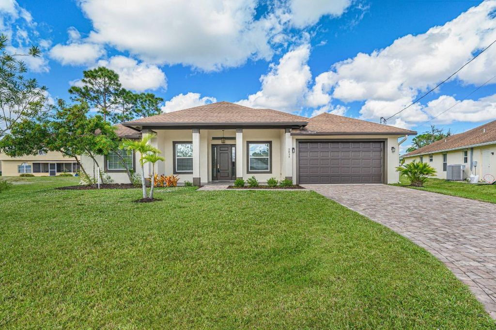 Photo of 5834 NW Lomb Court, Port Saint Lucie, FL 34986 (MLS # R10934752)