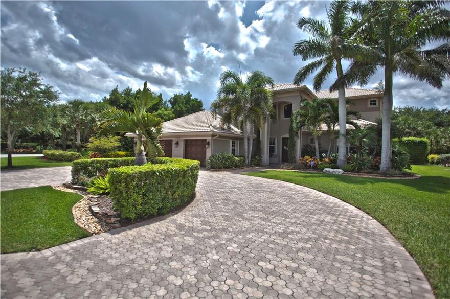 Beautifully maintained 5 bedroom pool home in The Vistas-Heron Bay.  Set on a meticulously landscaped and private oversized lot, this home features a first floor master suite with sitting area, 3 car garage, large circular driveway, screened pool with spa and many more upgrades. Private golf course community with Clubhouse, restaurant and pools.  Top rated schools! Move in ready and will not last!