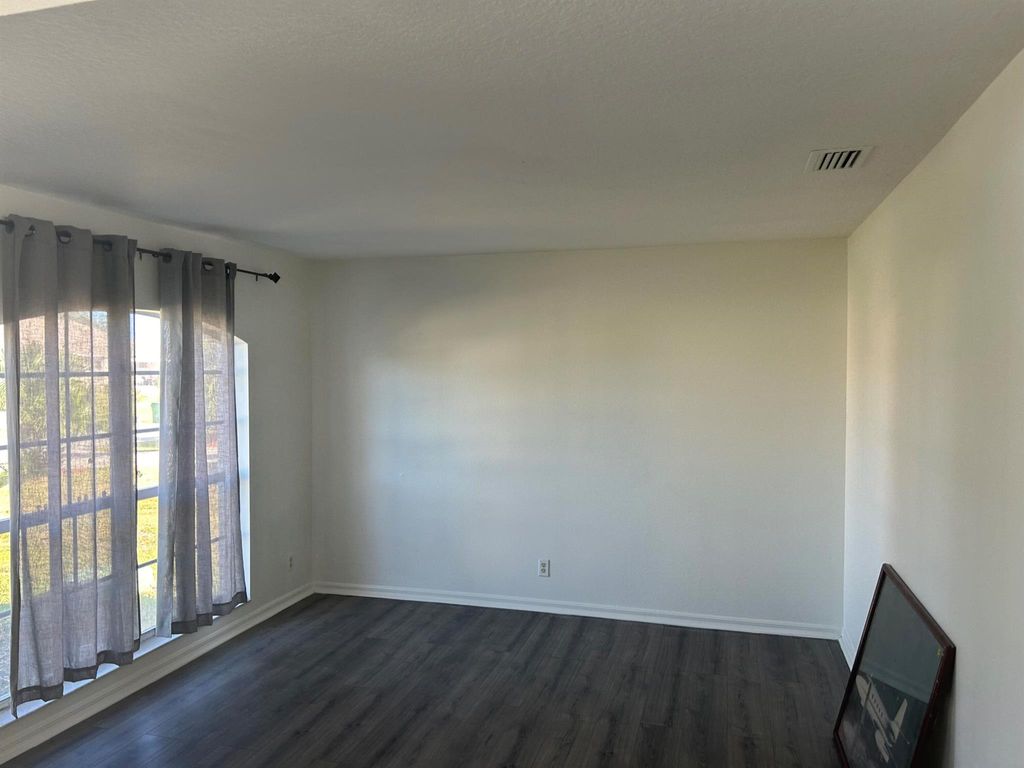 Photo of 932 SW Mcelroy Avenue, Port Saint Lucie, FL 34953 (MLS # R11039373)