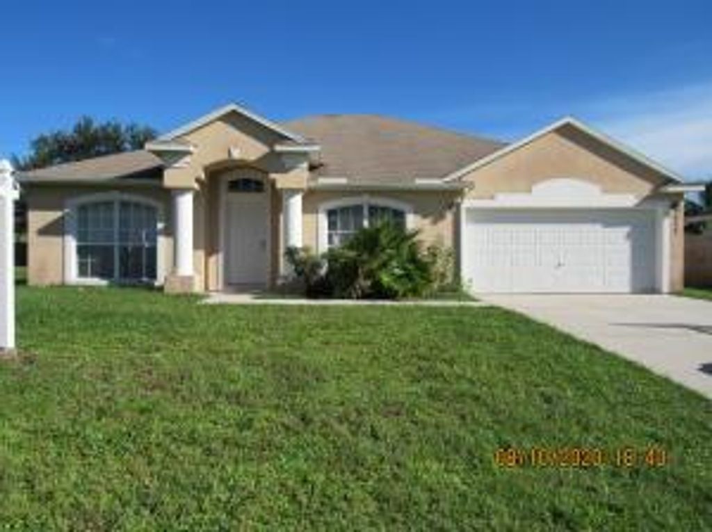 Photo of 932 SW Mcelroy Avenue, Port Saint Lucie, FL 34953 (MLS # R11039373)
